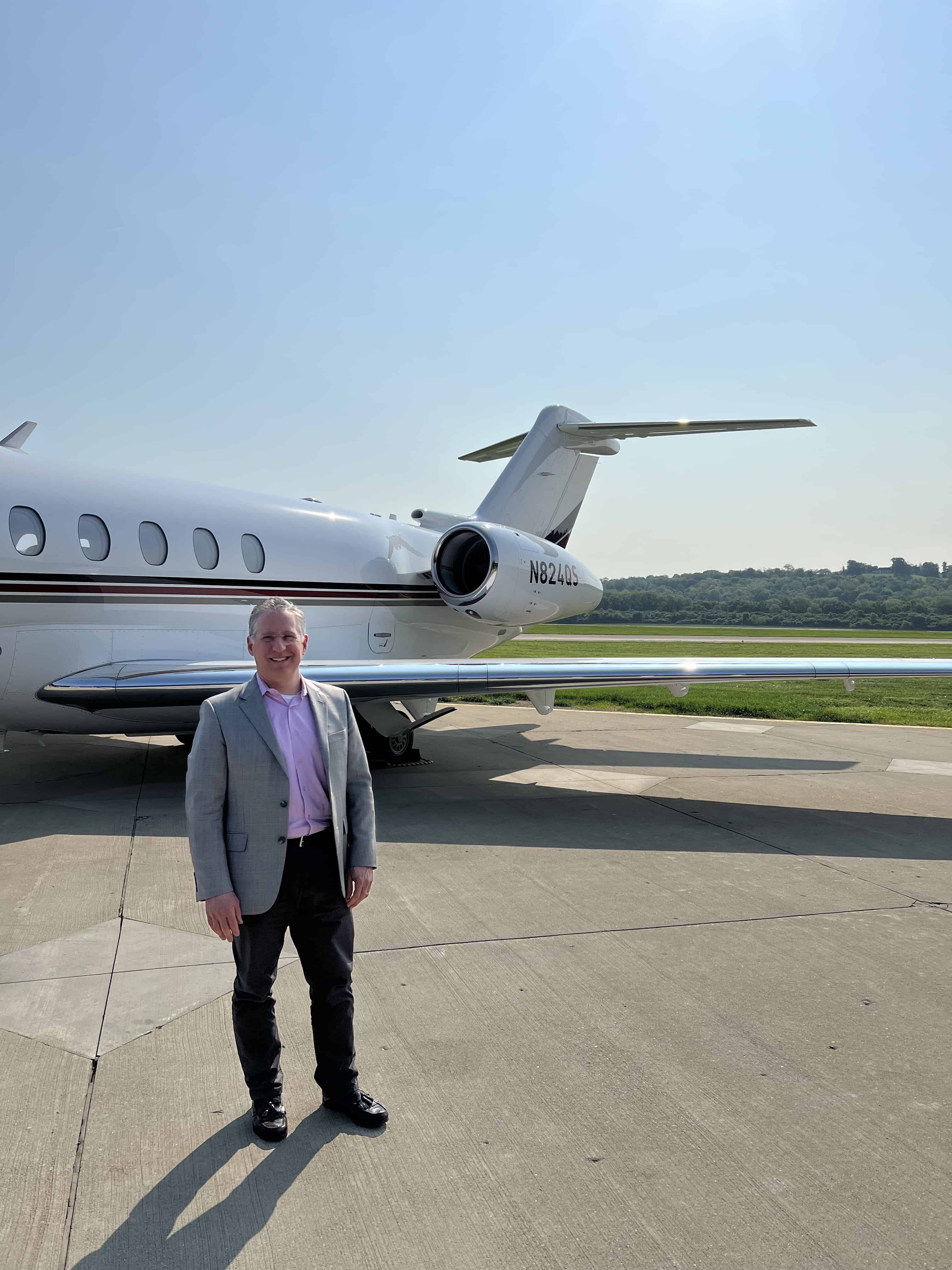 Brian and private jet on office tour